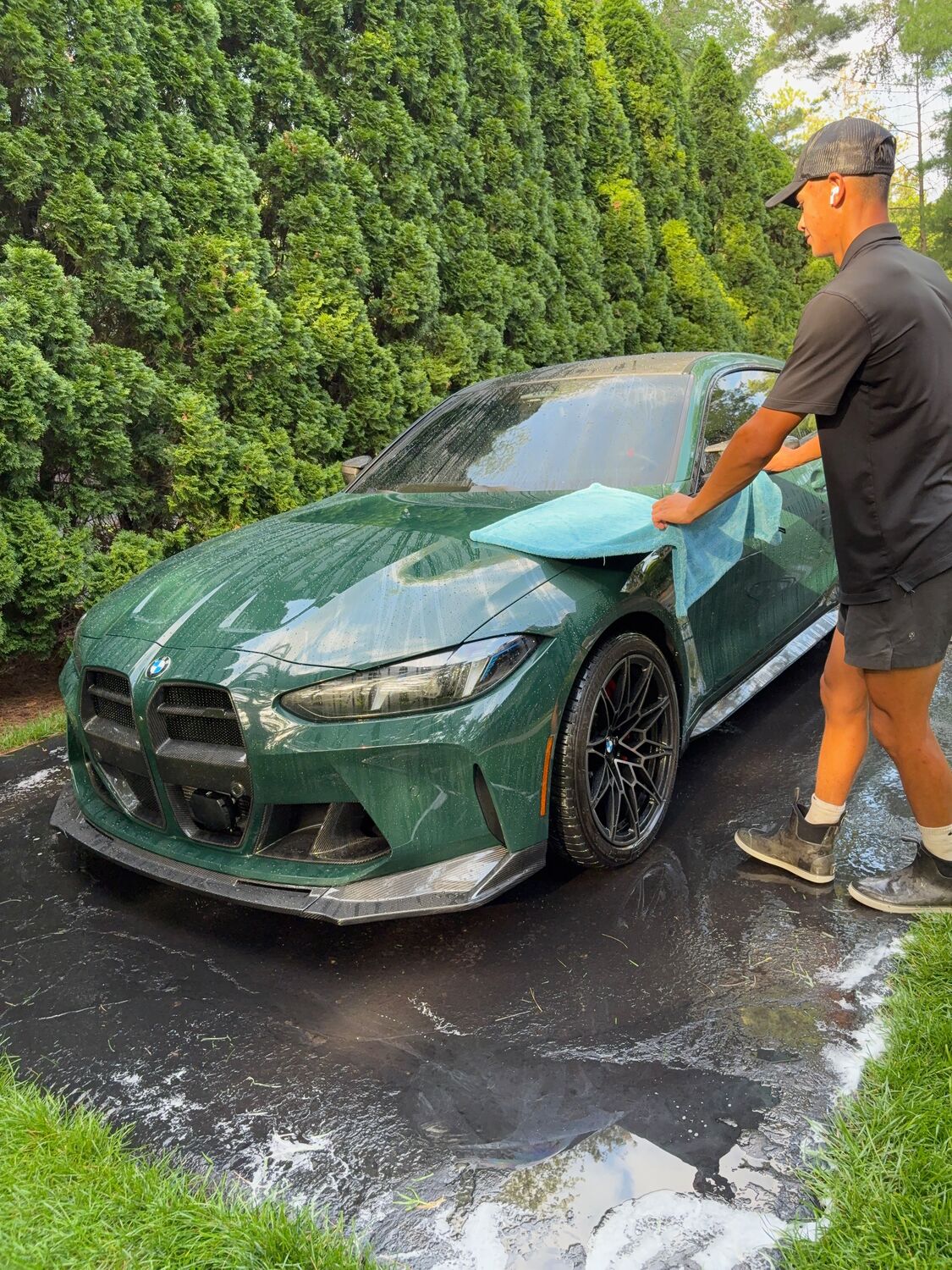 Final wipe-down on a BMW M4