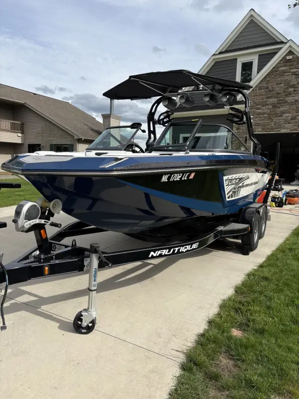 Detailed wakeboard boat on its trailer