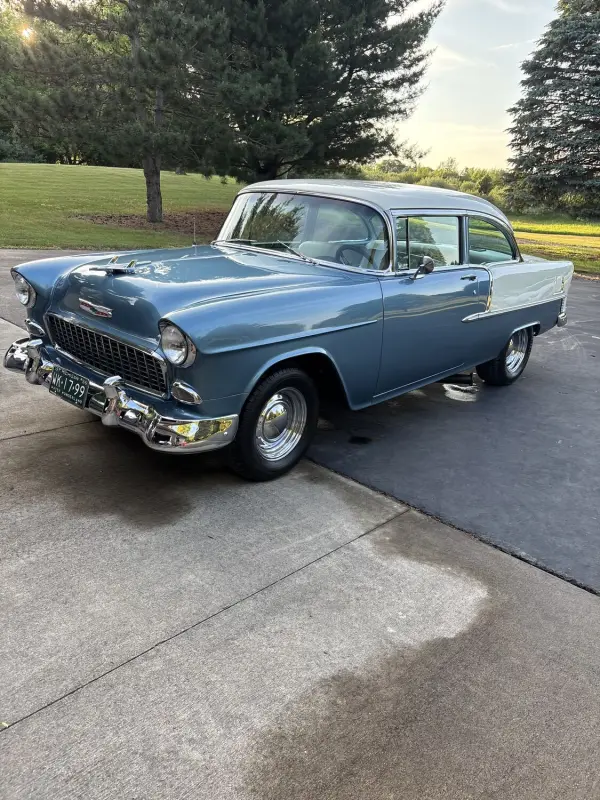 Classic blue sedan after a wash