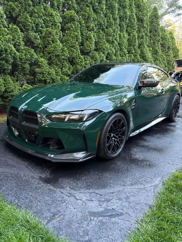 Glossy green BMW M4 after a detail