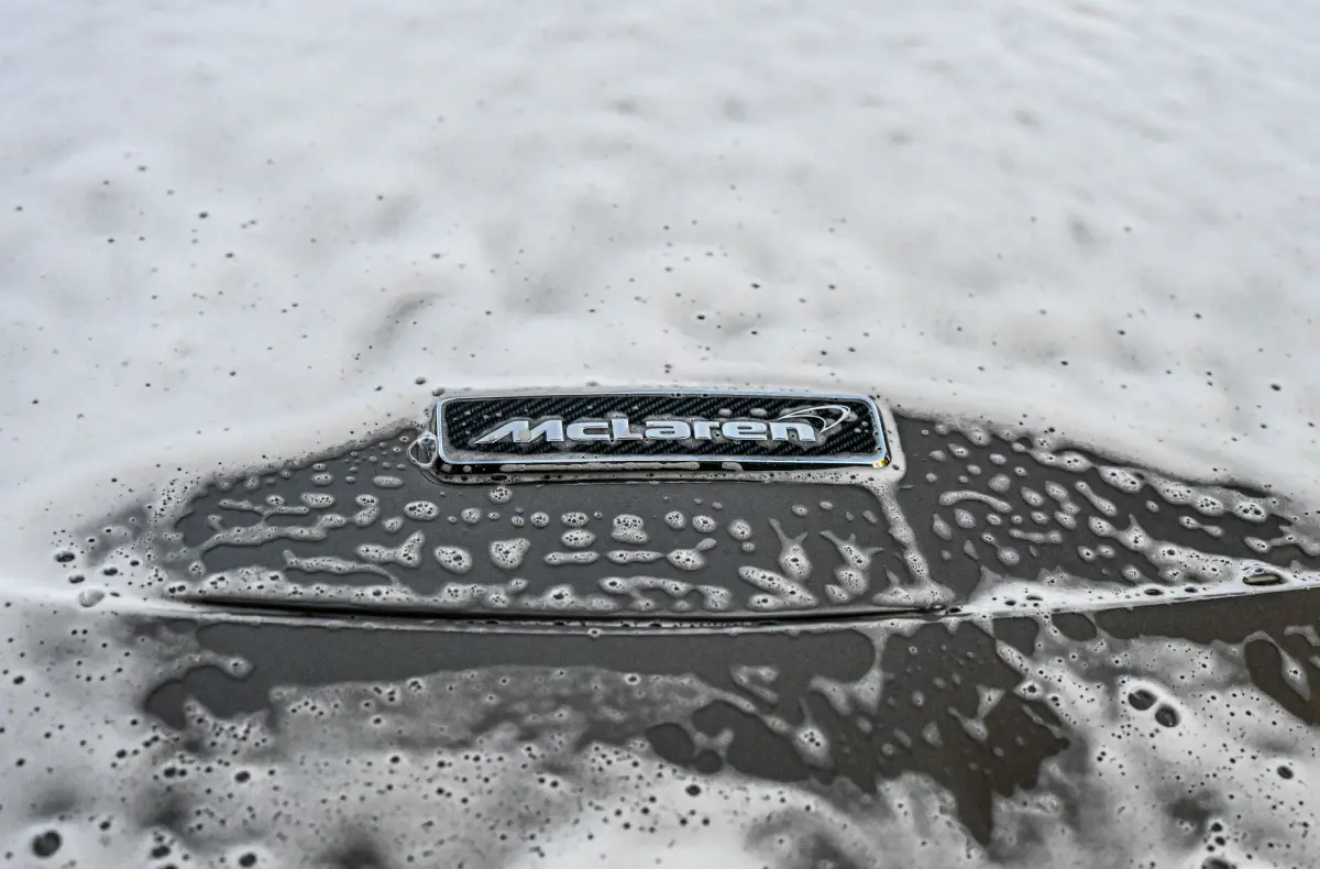 McLaren badge under a layer of wash foam