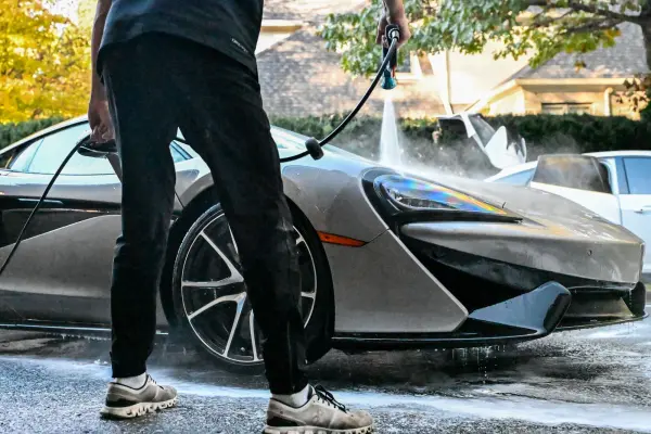 Rinsing foam off the McLaren