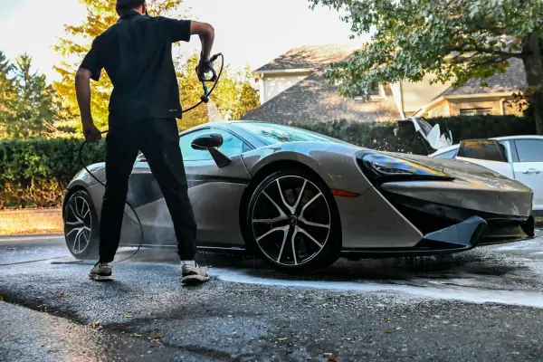 Rinsing the side of the McLaren