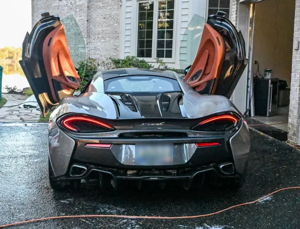 McLaren with doors up after the rinse
