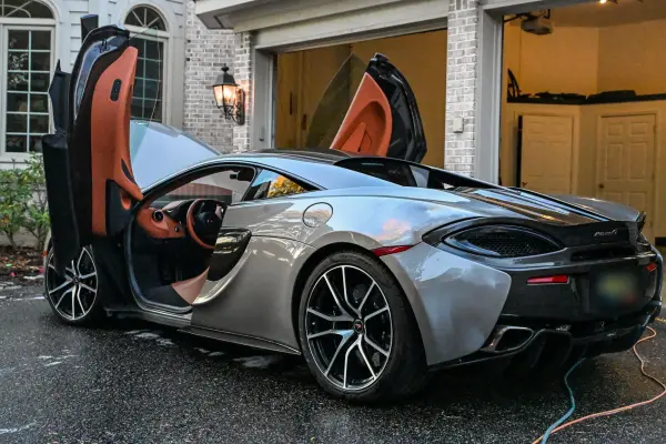 McLaren with doors up, rear three-quarter